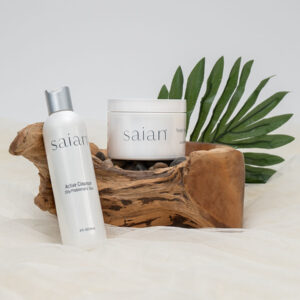 Lotion bottles sitting against and on wood as part of staged product photography shoot