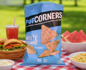 PopCorners bag staged on picnic table with food as part of lifestyle product photography